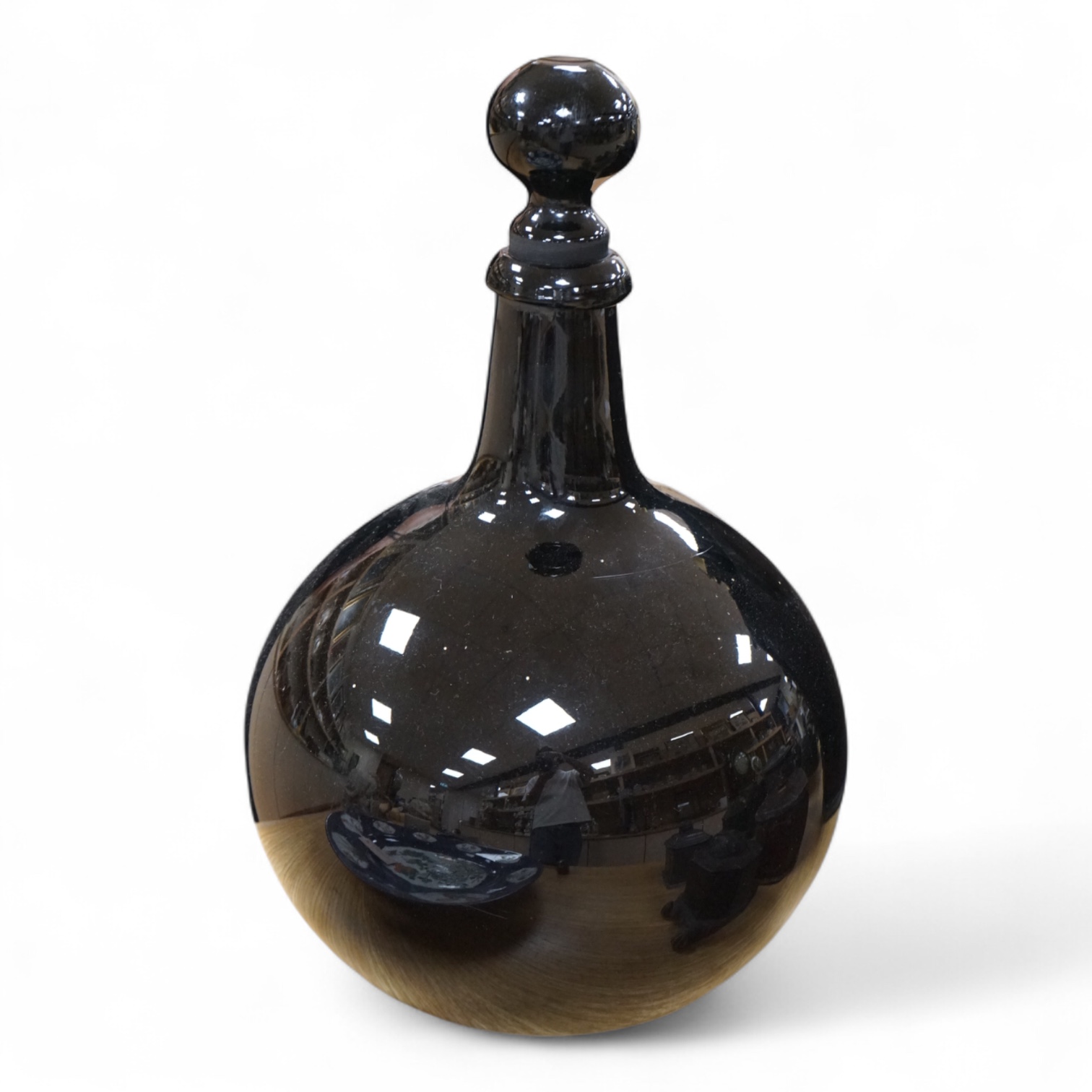 A late 19th / early 20th century dark amethyst pharmacy jar with stopper, 39cm high